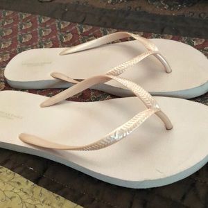 Blush colored flip flops